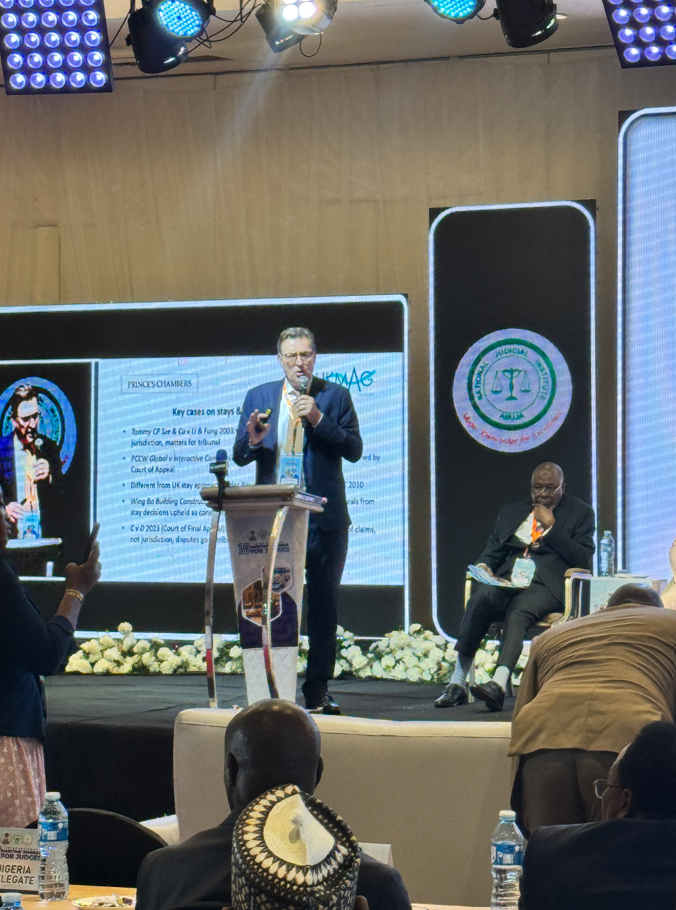 Edward presenting on stage at Nigeria shipping conference